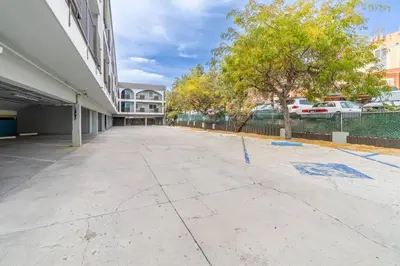 an empty sidewalk in front of a building at Midtown Getaway: Trendy Studio Heart of Reno in Reno