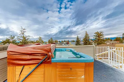 a hot tub sitting on top of a deck at Rooftop Retreat in South Lake Tahoe