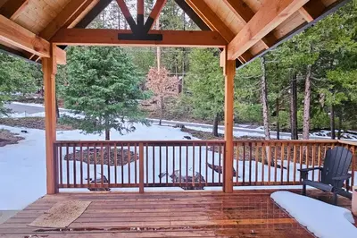 a screened in porch with snow on the ground at Groovy Days Chalet in Arnold