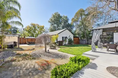 a garden with a patio and a house at ¤ Old Folsom La Boheme Artist Retreat + Jacuzzi ¤ in Folsom