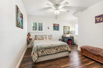 a bedroom with a bed and a ceiling fan at ¤ Old Folsom La Boheme Artist Retreat + Jacuzzi ¤ in Folsom