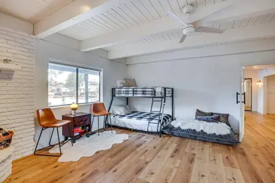 a room with two bunk beds and a table at 6 Mi to Slopes Mtn-View Retreat in Lake Tahoe in South Lake Tahoe