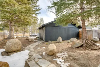 a building with trees and rocks in a yard at 6 Mi to Slopes Mtn-View Retreat in Lake Tahoe in South Lake Tahoe