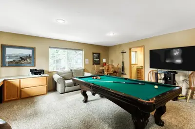 a living room with a pool table at Gentian Family Retreat in South Lake Tahoe