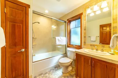 a bathroom with a toilet and a sink and a shower at Luxury home close to Village; Garage & Jacuzzi in Mammoth Lakes