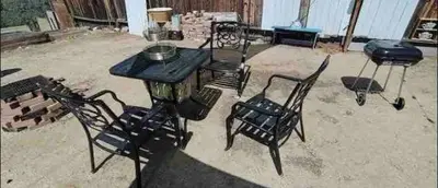 a table and two chairs and a grill in a yard at Private Guest Cozy Room w/Full Bathroom in Lake Isabella