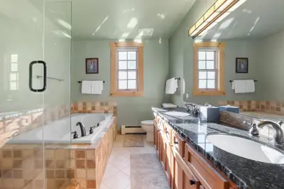 a bathroom with two sinks and a shower at Lavishness at Elevation – Timber Ridge 3 Bedroom condo in Kirkwood