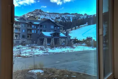 a view from a window of a mountain at Luxury at Altitude – Base Camp 2 Bedroom condo in Kirkwood