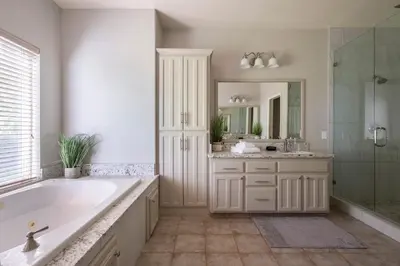 a bathroom with a tub and a sink and a mirror at Master Suite Fraser Family Vineyard Stay in Amador in Plymouth