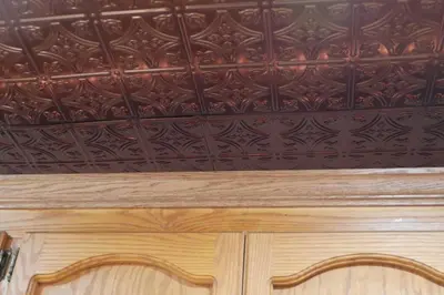 a room with a ceiling with a wooden cabinet at Big Cabin on the Creek in Camp Connell