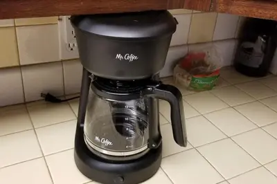 a black coffee maker sitting on a kitchen counter at Mountain Life On Deck in Arnold