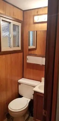 a small bathroom with a toilet and a sink at Mountain Life On Deck in Arnold