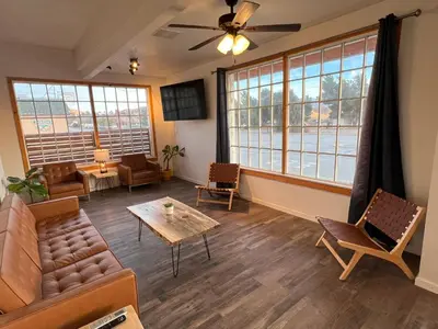 a living room with a couch and a table at Wofford Village Studios in Wofford Heights