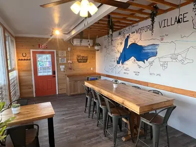 a dining room with wooden tables and chairs at Wofford Village Studios in Wofford Heights