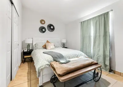 a white bedroom with a bed and a window at 4 Miles to Sequoia NTL Park in Three Rivers