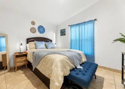 a bedroom with a bed and a blue bench at 4 Mil to Sequoia NTL Park Private River Access in Three Rivers