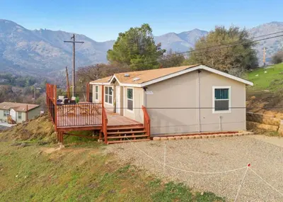 a small tiny house on a hill with a porch at 4 Mil to Sequoia NTL Park Private River Access in Three Rivers