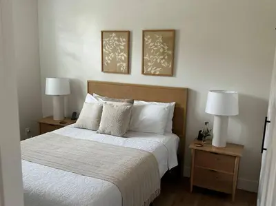 a bedroom with a bed with two nightstands and two lamps at Soleil Luna 2 miles from Sequoia Park Entrance in Three Rivers