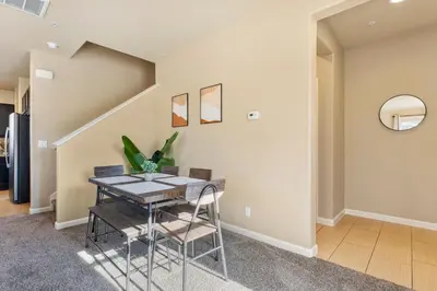 a dining room with a table and chairs at MidTown Hideaway Fire Pit and King Beds in Reno