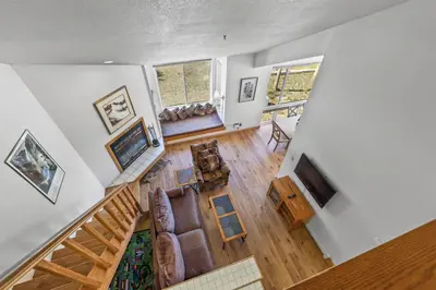 an overhead view of a living room with a staircase at Sierra Cabin Condo – Sun Meadows 1 BedroomLoft condo in Kirkwood