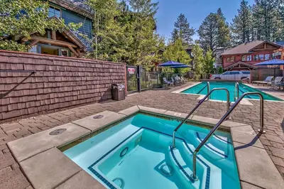 a pair of swimming pools in a yard at Sierra Shores Four - Lakefront Vistas in South Lake Tahoe