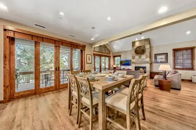 a dining room with a table and chairs at Sierra Shores Four - Lakefront Vistas in South Lake Tahoe