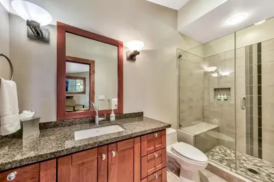 a bathroom with a sink and a toilet and a shower at Sierra Shores Four - Lakefront Vistas in South Lake Tahoe