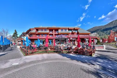 a building with tables and chairs in front of it at Sierra Shores Five - Lakefront Comfort in South Lake Tahoe