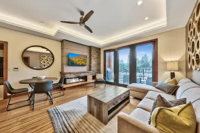 a living room with a couch and a table at Zalanta 222 – Luxe Stay by Gondola Lake in Stateline
