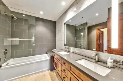 a bathroom with two sinks and a large mirror at Zalanta 222 – Luxe Stay by Gondola Lake in Stateline