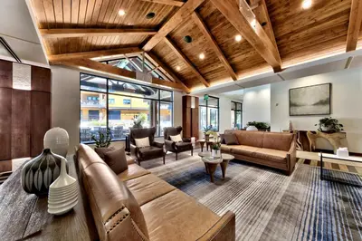 a living room with a couch and a table at Zalanta 222 – Luxe Stay by Gondola Lake in Stateline
