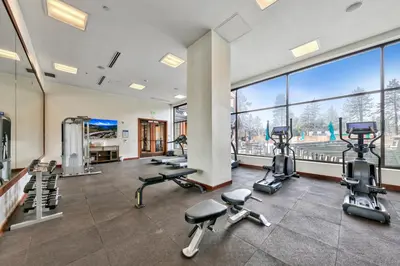 a gym with treadmills and cardio equipment in a building at Zalanta 222 – Luxe Stay by Gondola Lake in Stateline