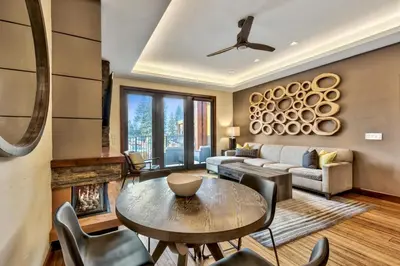 a living room with a table and a couch at Zalanta 222 – Luxe Stay by Gondola Lake in Stateline