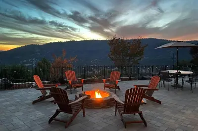 a group of chairs and a fire pit with a sunset at Stargazing Retreat: fire pit/hot tub near Yosemite in Ahwahnee