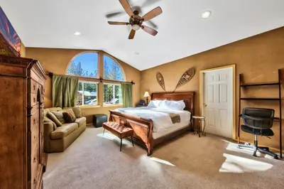 a bedroom with a bed and a ceiling fan at Heavenly Retreat in South Lake Tahoe