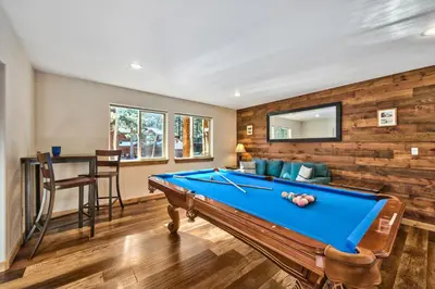 a living room with a pool table in it at Heavenly Retreat in South Lake Tahoe