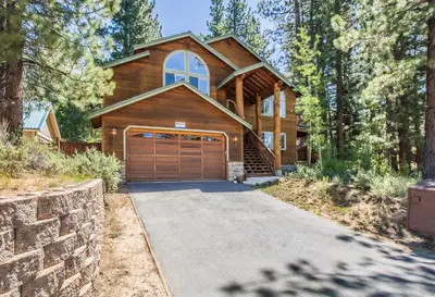 a house with a wooden garage and a driveway at Heavenly Retreat in South Lake Tahoe