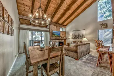 a living room with a table and a couch at Lakeland Village 410 in South Lake Tahoe