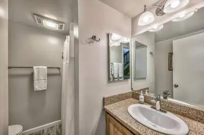 a bathroom with a sink and a mirror at Lakeland Village 410 in South Lake Tahoe