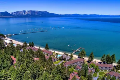 an aerial view of a beach with boats in the water at Lakeland Village 406 - The Lake Escape in South Lake Tahoe