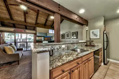 a kitchen with a sink and a large counter at Lakeland Village 521 - Come Lake It in South Lake Tahoe