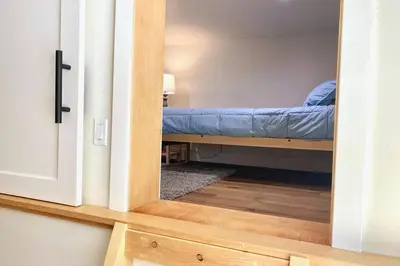 a bedroom with a bunk bed in a room at Timberwood Cottage in Downtown Twain Harte in Twain Harte
