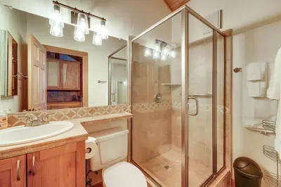 a bathroom with a shower and a toilet and a sink at Northstar Resort Condo with Hot Tub, Shuttle Access! in Truckee