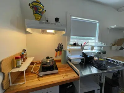 a kitchen with a counter top with a laptop on it at Petite Guesthouse with Kitchenette and Private Bathroom in Lake Isabella