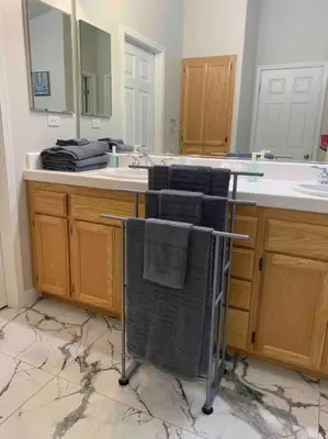 a bathroom with a sink and towels on a counter at Sweet Holiday in Antelope