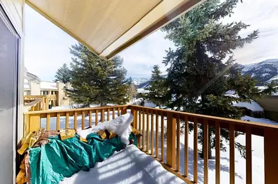 a bed on a balcony with snow on it at Snowcreek 264 in Mammoth Lakes