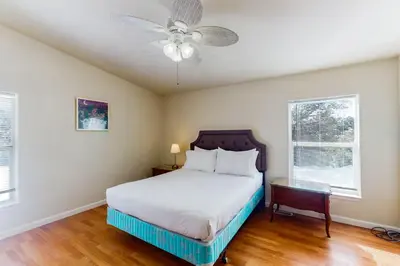 a bedroom with a bed and a ceiling fan at Zerenity Lookout East in Oakhurst