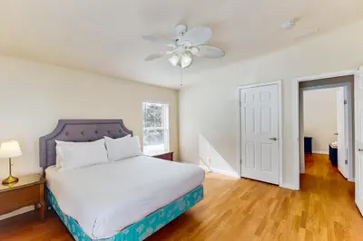 a bedroom with a bed and a ceiling fan at Zerenity Lookout East in Oakhurst