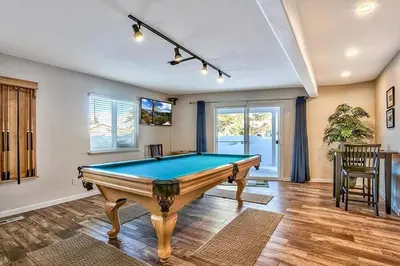 a living room with a pool table in it at 1759 Venice Drive home in Tahoe Keys