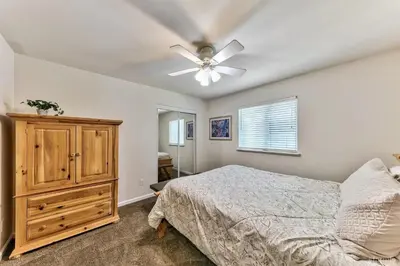 a bedroom with a bed and a ceiling fan at 1759 Venice Drive home in Tahoe Keys